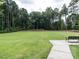 A vast green soccer field bordered by trees provides ample space for recreational activities at 3441 Jordan Shires Dr, New Hill, NC 27562