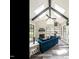 Cozy sunroom with vaulted ceilings, exposed beams, stone fireplace, and large windows with plenty of light at 3441 Jordan Shires Dr, New Hill, NC 27562