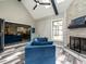 Inviting sunroom with vaulted ceilings, stone fireplace, and seamless indoor-outdoor living at 3441 Jordan Shires Dr, New Hill, NC 27562