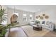 Cozy living room featuring a hanging chair, neutral decor, a comfortable sofa, and natural light perfect for relaxation at 361 Catheys Creek Cir, Wendell, NC 27591