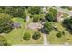 Aerial view of a home with a fenced backyard, mature trees, and a convenient carport at 409 Trail Two, Burlington, NC 27215