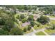 Scenic aerial view of a home surrounded by lush trees, green lawns, and peaceful neighborhood streets at 409 Trail Two, Burlington, NC 27215