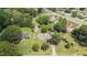 Idyllic aerial view of home with mature trees, grassy lawn, and convenient neighborhood location near roadways at 409 Trail Two, Burlington, NC 27215