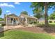Well-maintained backyard featuring a patio, deck and a lush lawn, great for entertaining at 409 Trail Two, Burlington, NC 27215