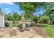 Inviting backyard patio with umbrella table and chairs, perfect for outdoor relaxation and dining at 409 Trail Two, Burlington, NC 27215