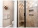 Elegant bathroom featuring a glass-enclosed shower with decorative tile and a built-in corner seat at 409 Trail Two, Burlington, NC 27215