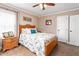 Bedroom featuring a classic wooden bed frame, bright windows, and decorative accents at 409 Trail Two, Burlington, NC 27215