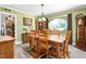 Dining room featuring a wooden table set, round window, and bright paint at 409 Trail Two, Burlington, NC 27215
