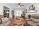 Spacious living area with hardwood flooring, fireplace, and doors leading to an outdoor space at 409 Trail Two, Burlington, NC 27215