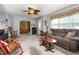 Bright living room with comfortable seating, an archway to the dining room, and ample natural light at 409 Trail Two, Burlington, NC 27215