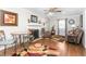 Cozy living room displaying hardwood floors, a fireplace, neutral wall colors, and coordinated decor at 409 Trail Two, Burlington, NC 27215