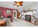 Comfortable living room with a brick fireplace, classic decor, and soft, neutral carpeting at 409 Trail Two, Burlington, NC 27215