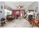 Inviting living room featuring a fireplace, neutral carpeting, and vintage-style furnishings at 409 Trail Two, Burlington, NC 27215