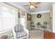 Bright and airy sunroom with wicker seating, neutral carpet, and natural light at 409 Trail Two, Burlington, NC 27215