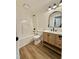 Bright bathroom with custom vanity, modern fixtures, and shower-tub combination at 41 Lakewood Dr, Roxboro, NC 27573