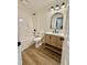 Bright bathroom with custom vanity, modern fixtures, and shower-tub combination at 41 Lakewood Dr, Roxboro, NC 27573