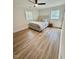 Cozy bedroom with natural light, a ceiling fan, and wood-look flooring at 41 Lakewood Dr, Roxboro, NC 27573