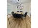 Bright dining room with wood floors, recessed lighting, and a chandelier above the dining table at 41 Lakewood Dr, Roxboro, NC 27573