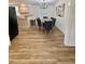 Elegant dining room with modern lighting, wood floors, and stylish seating at 41 Lakewood Dr, Roxboro, NC 27573