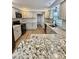 Bright kitchen featuring granite countertops, stainless steel appliances, and modern lighting at 41 Lakewood Dr, Roxboro, NC 27573