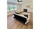 Light-filled living room with wood floors, recessed lights, fireplace, and a comfortable seating area at 41 Lakewood Dr, Roxboro, NC 27573