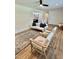 Inviting living room featuring stylish wood floors, a ceiling fan and neutral wall paint at 41 Lakewood Dr, Roxboro, NC 27573
