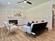 Comfortable living room boasting wood floors, recessed lighting, and a modern fireplace at 41 Lakewood Dr, Roxboro, NC 27573