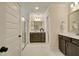 Bright bathroom featuring a double sink vanity, white marble floors, and a glass enclosed shower at 4106 Sweet Ivy Lndg # 179, Durham, NC 27703