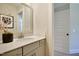 Clean bathroom with a white vanity, framed mirror, and stylish decor at 4106 Sweet Ivy Lndg # 179, Durham, NC 27703