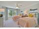 bedroom with two beds, ceiling fan, and a window at 4106 Sweet Ivy Lndg # 179, Durham, NC 27703