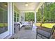 Cozy covered porch with comfortable seating and views of the lush backyard at 4106 Sweet Ivy Lndg # 179, Durham, NC 27703