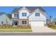 Charming two-story home with stone accents, manicured lawn and attached two car garage at 4106 Sweet Ivy Lndg # 179, Durham, NC 27703