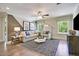Comfortable living room with a large sofa, modern lighting, and ample natural light at 4106 Sweet Ivy Lndg # 179, Durham, NC 27703