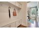 Functional mudroom with built-in storage, hooks, and a view into the office space at 4106 Sweet Ivy Lndg # 179, Durham, NC 27703