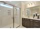 Close up on the spacious, tiled shower with a glass door, showerhead, and soap nook at 4106 Sweet Ivy Lndg # 179, Durham, NC 27703