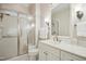 Elegant bathroom featuring a white vanity, shower with glass doors, and modern fixtures at 4137 Gardenlake Dr, Raleigh, NC 27612