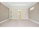 Spacious bedroom featuring decorative wallpaper accents and a tray ceiling with recessed lighting at 4137 Gardenlake Dr, Raleigh, NC 27612