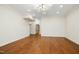 Spacious bonus room with hardwood floors, modern lighting, and recessed lights, ready for personalization at 4137 Gardenlake Dr, Raleigh, NC 27612