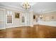Open-concept dining room featuring classic design, built-in shelves, and ample natural light at 4137 Gardenlake Dr, Raleigh, NC 27612