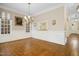 Bright dining room with chandelier, classic accents, and opening to hallway beyond at 4137 Gardenlake Dr, Raleigh, NC 27612