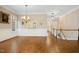 Traditional dining room with hardwood floors, chandelier, and easy access to the hallway at 4137 Gardenlake Dr, Raleigh, NC 27612
