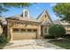 Stunning stone home featuring an attached garage and meticulously maintained landscaping at 4137 Gardenlake Dr, Raleigh, NC 27612