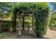 Tranquil gazebo covered in greenery offering a serene spot for outdoor dining and relaxation at 4137 Gardenlake Dr, Raleigh, NC 27612