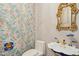 Charming powder room featuring floral wallpaper and a unique pedestal sink at 4137 Gardenlake Dr, Raleigh, NC 27612