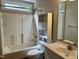 A standard bathroom with a shower-tub combo and single sink vanity with a bright light at 424 Shawnee Dr, Louisburg, NC 27549