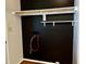 A spacious closet area with shelving, a hanging rod, and black painted wall at 424 Shawnee Dr, Louisburg, NC 27549