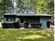 Charming single story home with green paint, brown trim, and covered porch at 424 Shawnee Dr, Louisburg, NC 27549