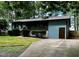 Single story home with green siding and concrete driveway at 424 Shawnee Dr, Louisburg, NC 27549