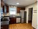 Updated kitchen with stainless steel appliances and dark wood cabinets at 424 Shawnee Dr, Louisburg, NC 27549