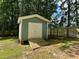 Storage shed with a ramp and double doors, great for storing gardening tools at 424 Shawnee Dr, Louisburg, NC 27549